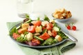 Salad with meat, cucumbers, tomatoes and croutons