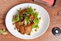 Salad with medallions of fried pork, Turkish walnut, shiitake mushrooms, bell pepper, apple, lettuce and dill Royalty Free Stock Photo