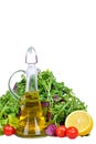 Salad mix with bottle of olive oil and lemon isolated on white Royalty Free Stock Photo