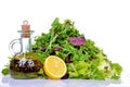 Salad mix with bottle of olive oil and lemon on white Royalty Free Stock Photo