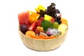 Salad with mixed fruits and vegetable in wooden bowl.