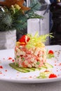 Salad Olivier with salmon, lemon and caviar