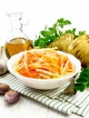 Salad of parsnip and carrot on table