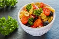 Salad: pasta fusilli, black and green olives, cherry tomatoes, red onion and parsley Royalty Free Stock Photo