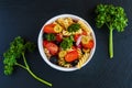 Salad: pasta fusilli, black and green olives, cherry tomatoes, red onion and parsley Royalty Free Stock Photo