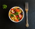 Salad: pasta fusilli, black and green olives, cherry tomatoes, red onion and parsley Royalty Free Stock Photo