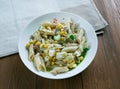 Salad with pasta, sardines .