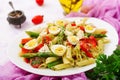 Salad - penne pasta with asparagus, tomatoes, quail eggs Royalty Free Stock Photo