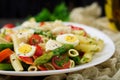 Salad - penne pasta with asparagus, tomatoes, quail eggs Royalty Free Stock Photo