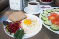 Salad plate and scrambled egg with cup cofee on table Royalty Free Stock Photo