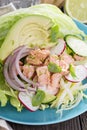 Salad with poached salmon and vegetables