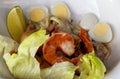 Salad with prawns and quail eggs in a white designer plate Royalty Free Stock Photo