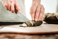 Selective focus of a cucumber being cut