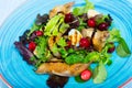 Salad with quail, berries and sauce