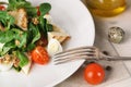 Salad with quail egg, cherry tomato, crackers and corn salad on white and wooden background Royalty Free Stock Photo