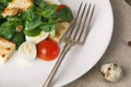 Salad with quail egg, cherry tomato, crackers and corn salad on wooden background Royalty Free Stock Photo