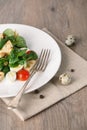 Salad with quail egg, cherry tomato, crackers and corn salad on wooden background Royalty Free Stock Photo