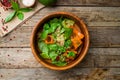 Salad with quinoa and shpinach on wooden table Royalty Free Stock Photo