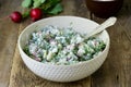 Salad with radish, dill and sour cream