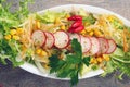Salad with radish and mais on wooden table Royalty Free Stock Photo
