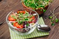 Salad with red cabbage, radish sprouts, corn