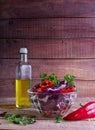 Salad of red cabbage and sweet red pepper, seasoned with lemon juice and olive oil in wooden table Royalty Free Stock Photo