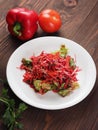 Salad of red and white cabbage and sweet red pepper, seasoned with olive oil Royalty Free Stock Photo