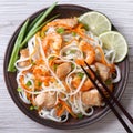 Salad of rice noodles with chicken, shrimp and vegetables