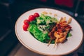 Salad rucola squid Shrimp asparagus , seafood salad at restaurant, close up view. Eating Asian Japanese food leisure concept