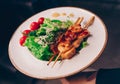 Salad rucola squid Shrimp asparagus , seafood salad at restaurant, close up view. Eating Asian Japanese food leisure concept