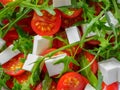 Salad from rukkola  cheese and tomato Royalty Free Stock Photo