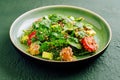 Salad with salmon, couscous, avocado and tomatoes