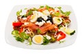 Salad with salmon, fresh tomato, cucumber and quail eggs at plate