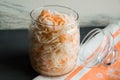 Salad of sauerkraut and carrots in rustic style. Pickled cabbage with carrots. Marinated cabbage in glass jar