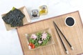 Salad of sea cabbage chuka, octopus, soy sauce - sea kale chips Royalty Free Stock Photo