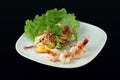 Salad with seafoods on a black background Royalty Free Stock Photo