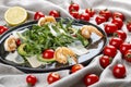 Salad with shrimp, cherry tomatoes, avocado and arugula on textile background Royalty Free Stock Photo