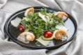 Salad with shrimp, cherry tomatoes, avocado and arugula on textile background Royalty Free Stock Photo