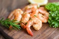Salad shrimp grilled delicious seasoning spices on wooden cutting board background appetizing cooked shrimps baked prawns Seafood Royalty Free Stock Photo