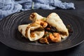 Salad with shrimp and pita bread. Seafood and vegetable on black ceramic plate.  Gourmet, restaurant healthy food concept. Dark Royalty Free Stock Photo