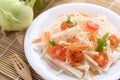 Salad with sliced kohlrabi, carrot, tomato and mizuna leaf