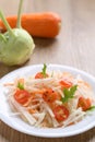 Salad with sliced kohlrabi, carrot, tomato and mizuna leaf