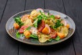 Salad with soft cheese, radish, pear, pumpkin and sun dried tomato Royalty Free Stock Photo