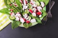 Salad with sorrel, cucumber, radish, speenach, sesame and cheese