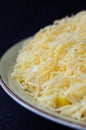 Salad sprinkled with grated cheese closeup Royalty Free Stock Photo