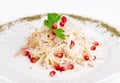 Salad with squid, onion, apple and pomegranate