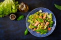 Salad of stewed fish salmon, broccoli, lettuce and dressing