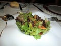 Salad with tender shoots of lettuce with carrot scratches