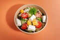 Salad with tofu cheese and vegetables. In a food delivery plate. Close-up. View from above. Isolated Royalty Free Stock Photo