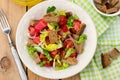 Salad with tomato, lettuce, onions and rye bread Royalty Free Stock Photo